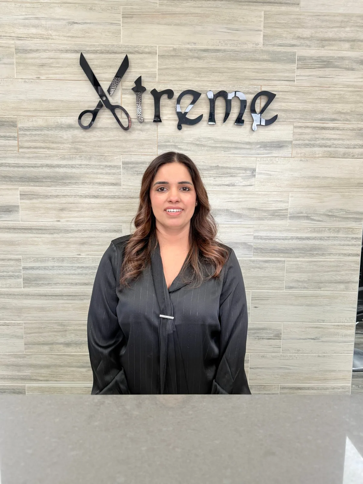 A Xtreme team member at the reception desk